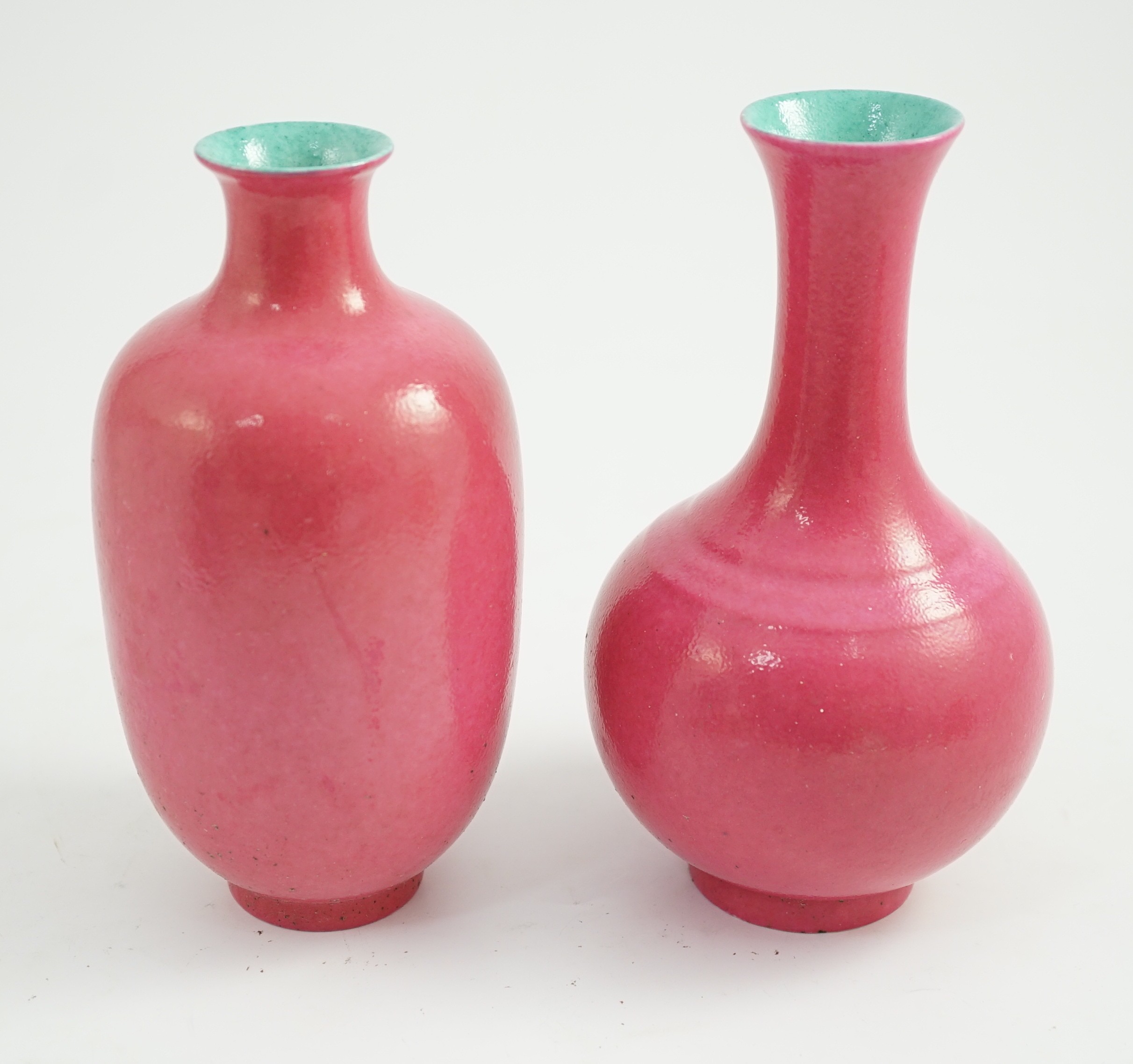 Two Chinese ruby ground vases, possibly Republic period, each with a printed four character Qianlong mark, 18.5 and 19.4cm high